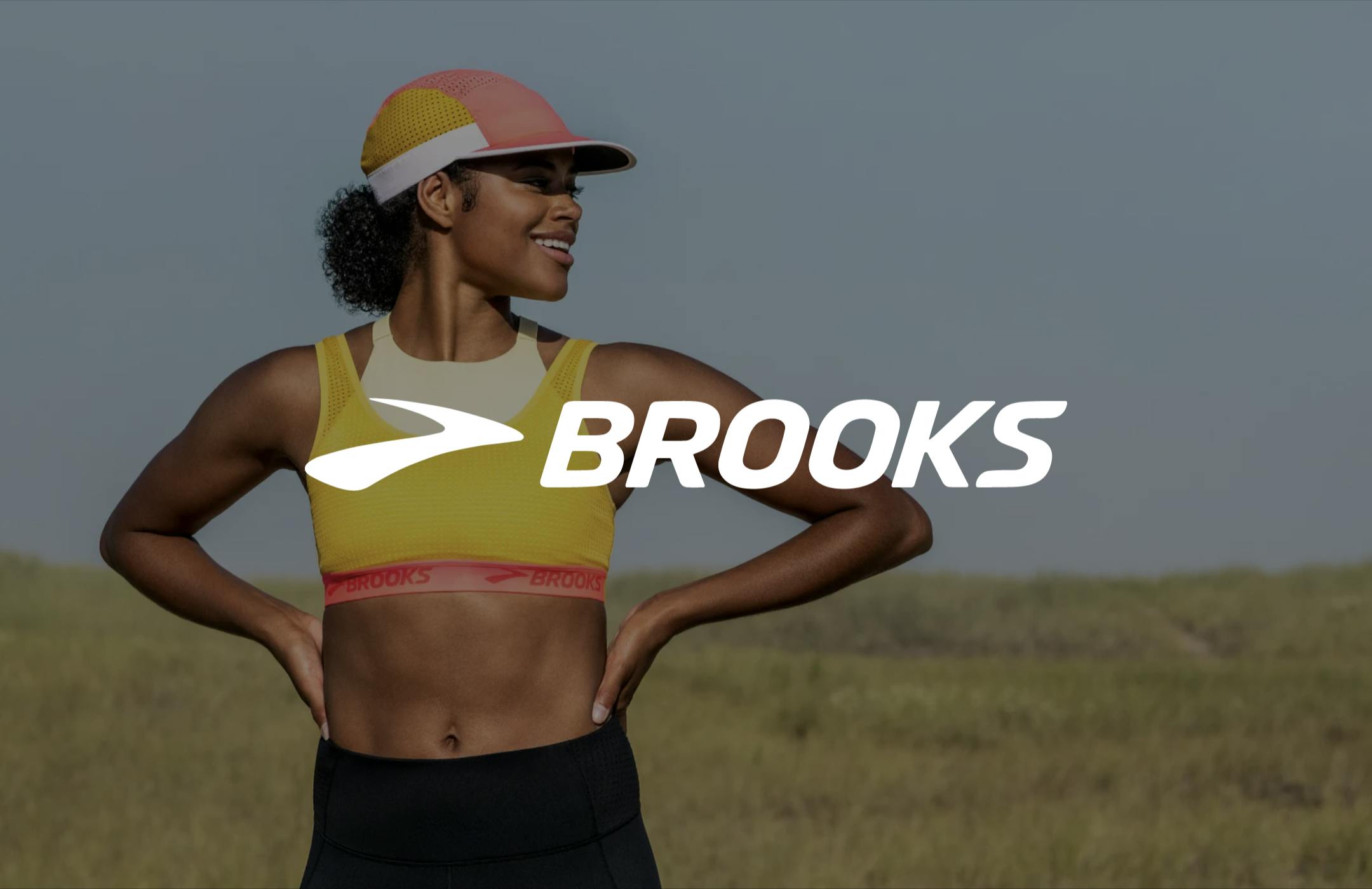 Brooks logo overlaid on top of an image of a runner