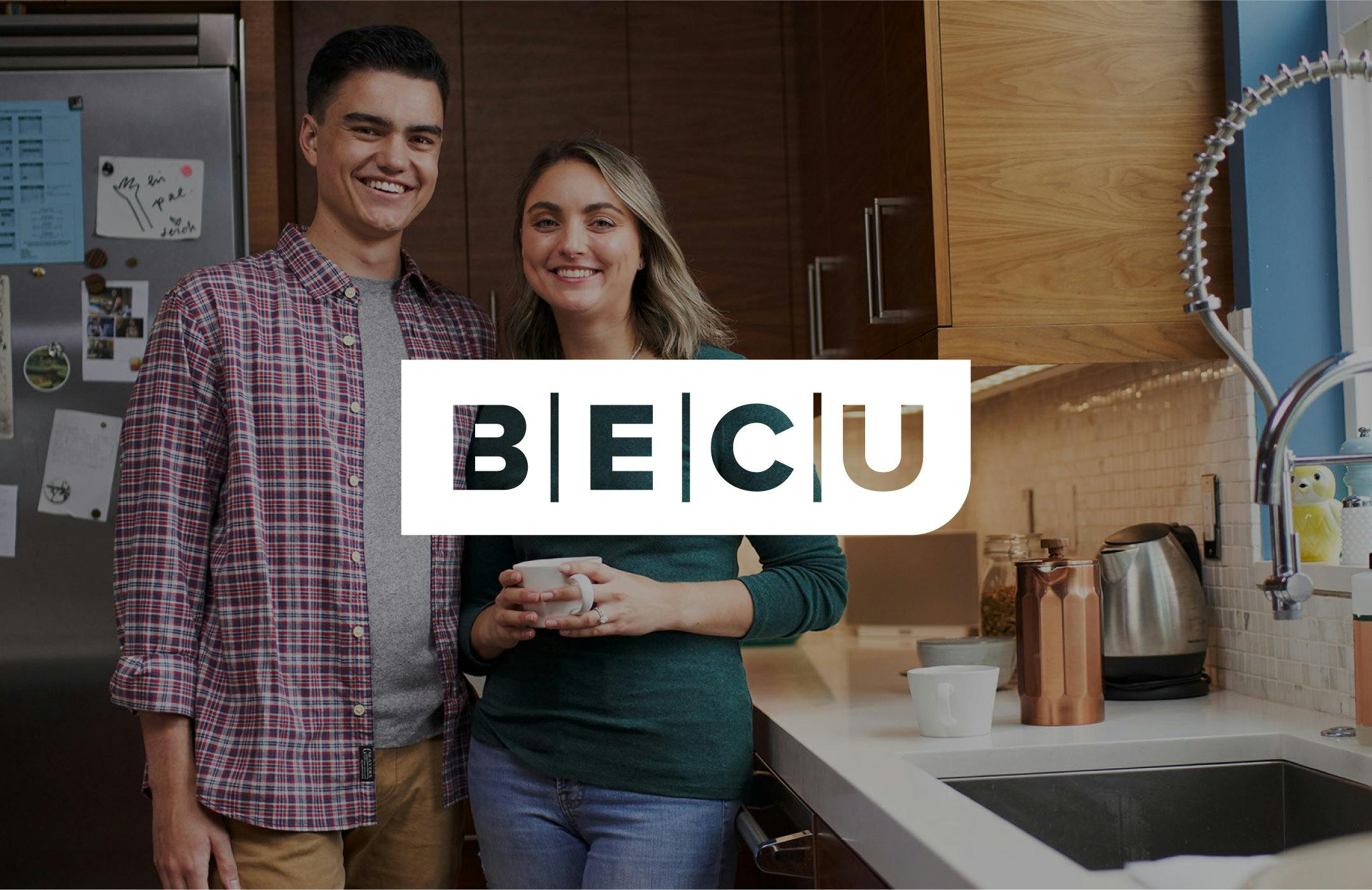 BECU Logo overlaid on a photo of a couple in a modern kitchen