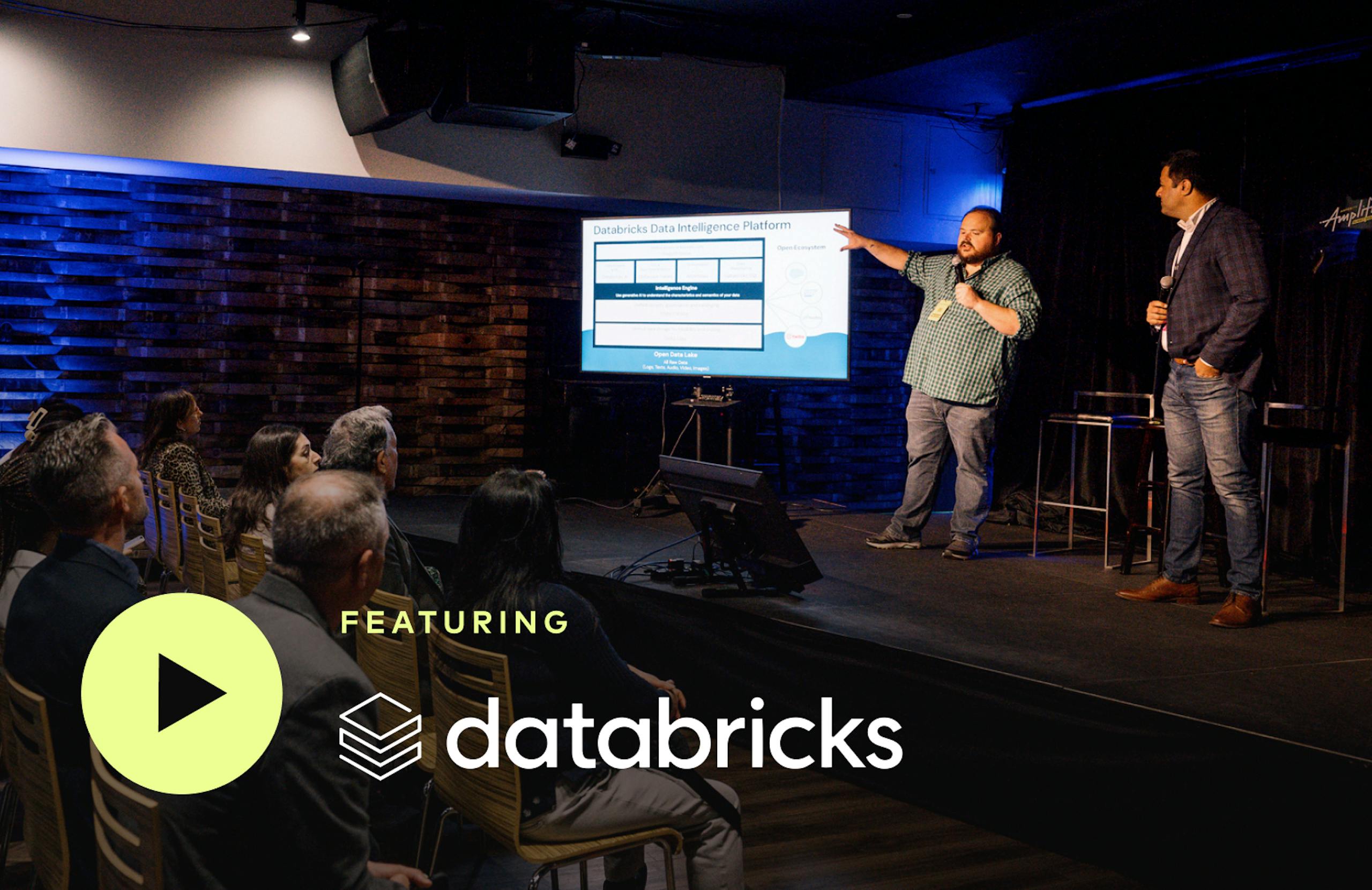 Caleb from Amperity and Shiv from Databricks onstage at Amplify. Featuring Databricks.