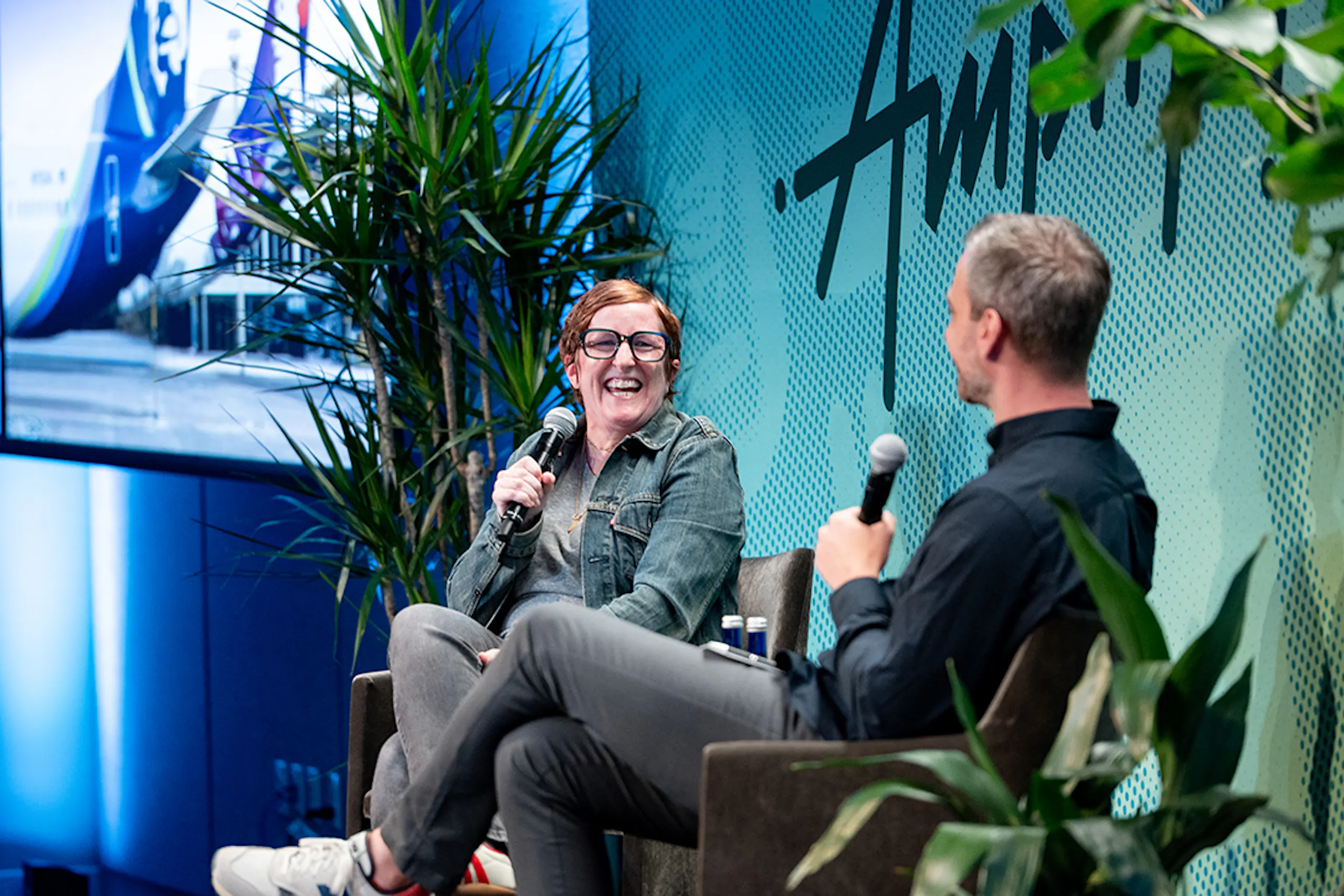 Lori Ho (Alaska Airlines) and Derek Slager (CTO) on stage at Amperity