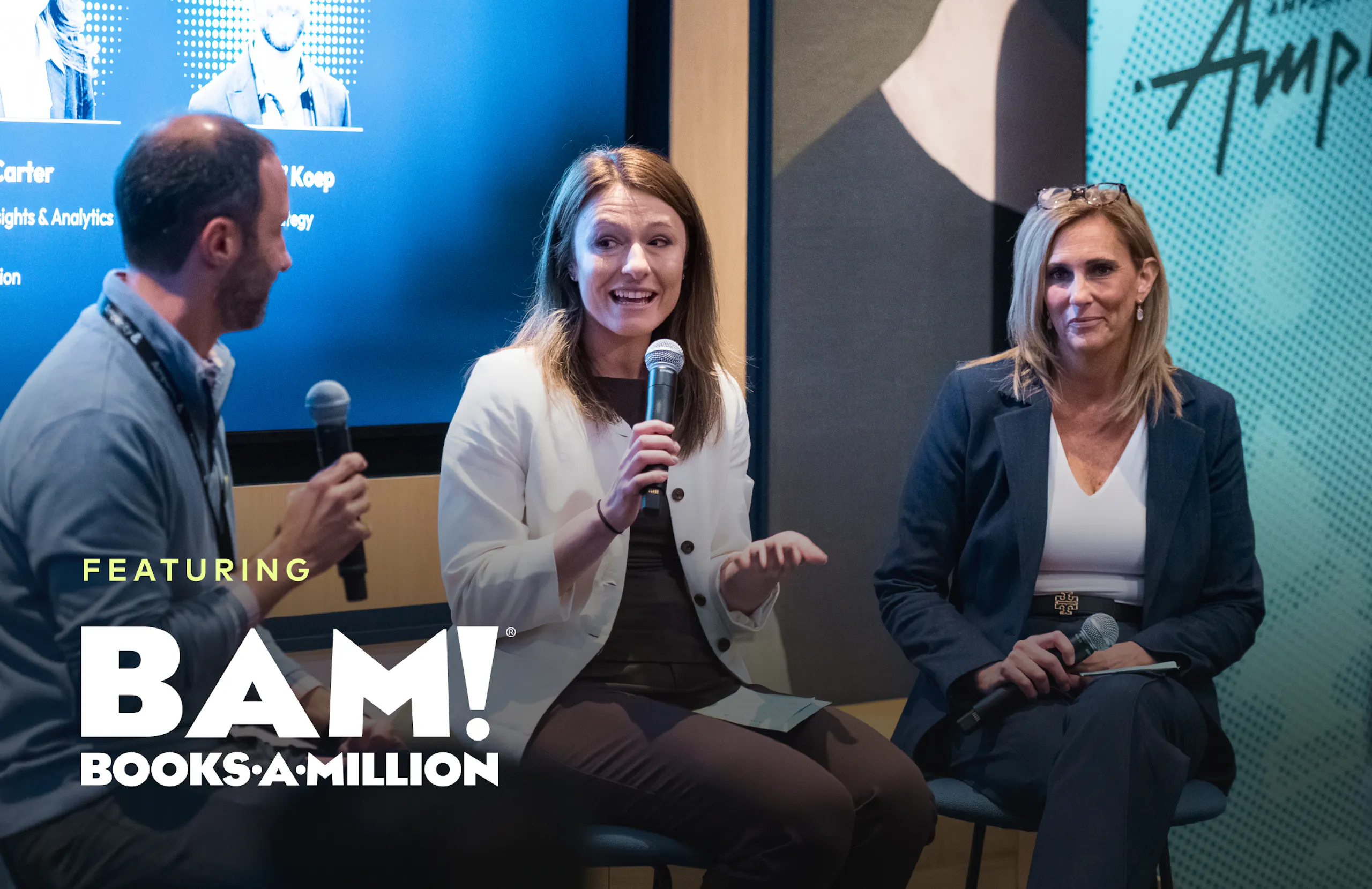 A man and two women onstage at Amplify with handheld mics. Featuring Books-A-Million.
