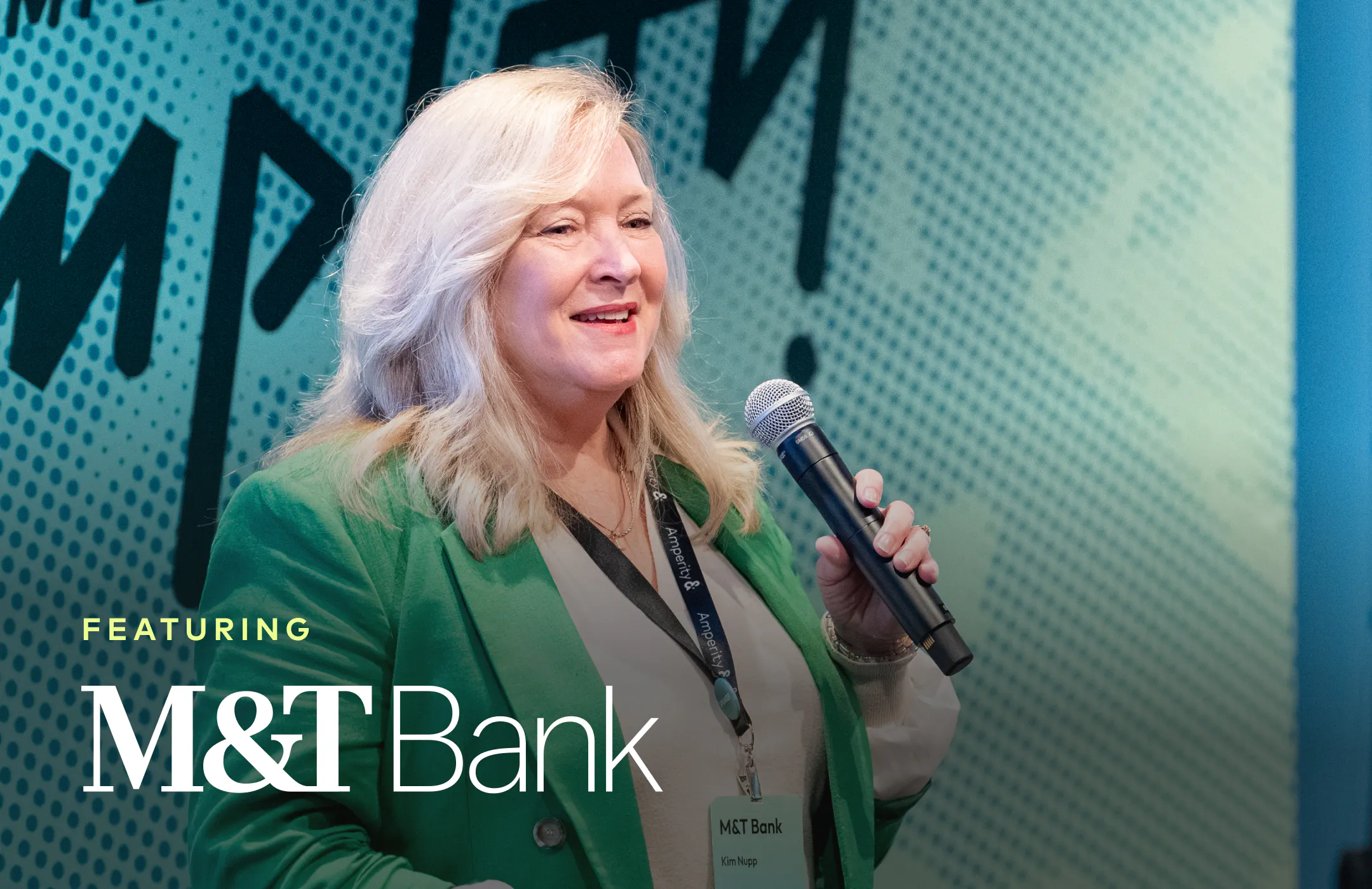 Kim Nupp, M&T Bank, in a green jacket onstage at Amplify 2026.
