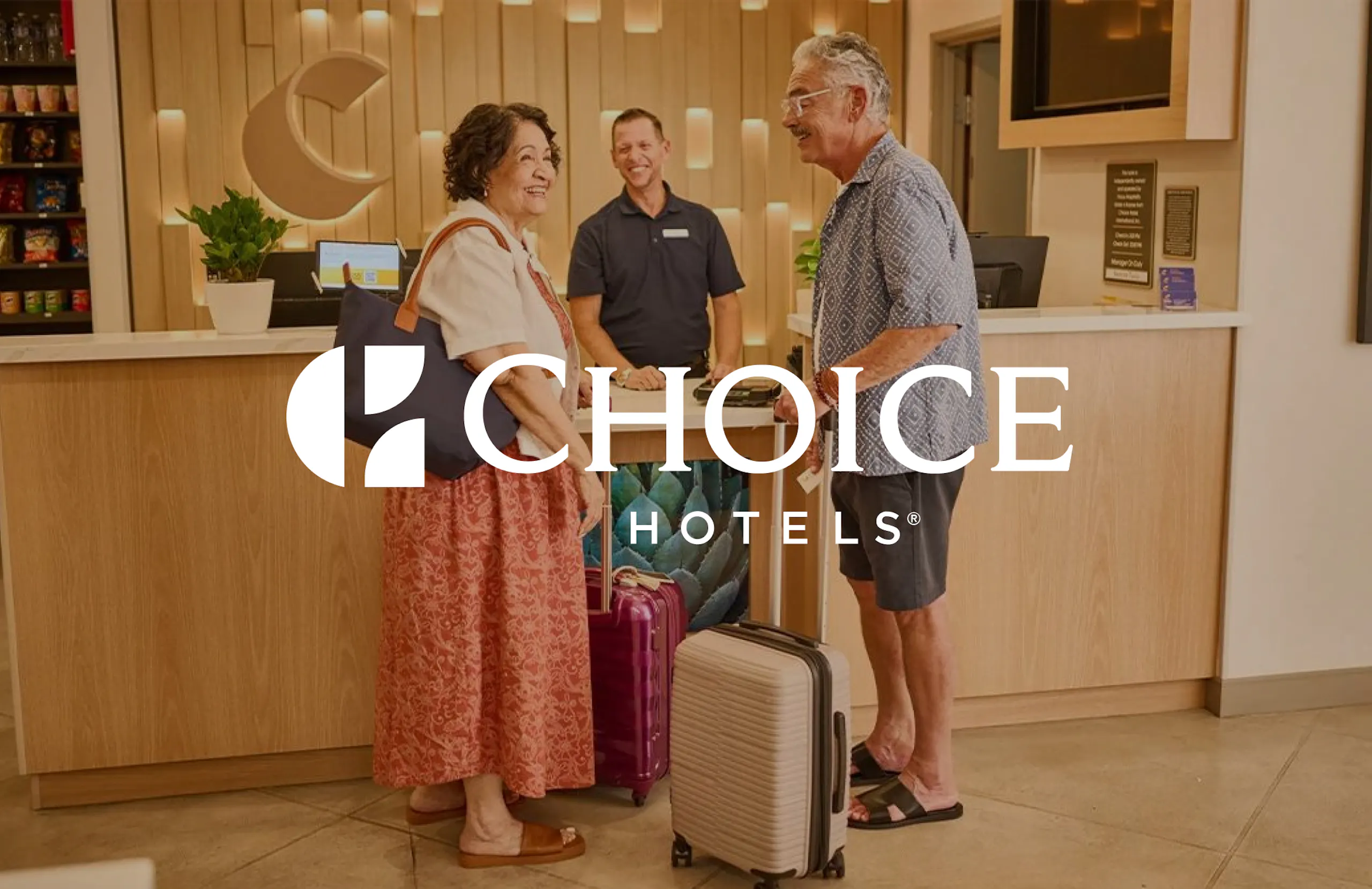Senior couple checking in at a Choice Hotel